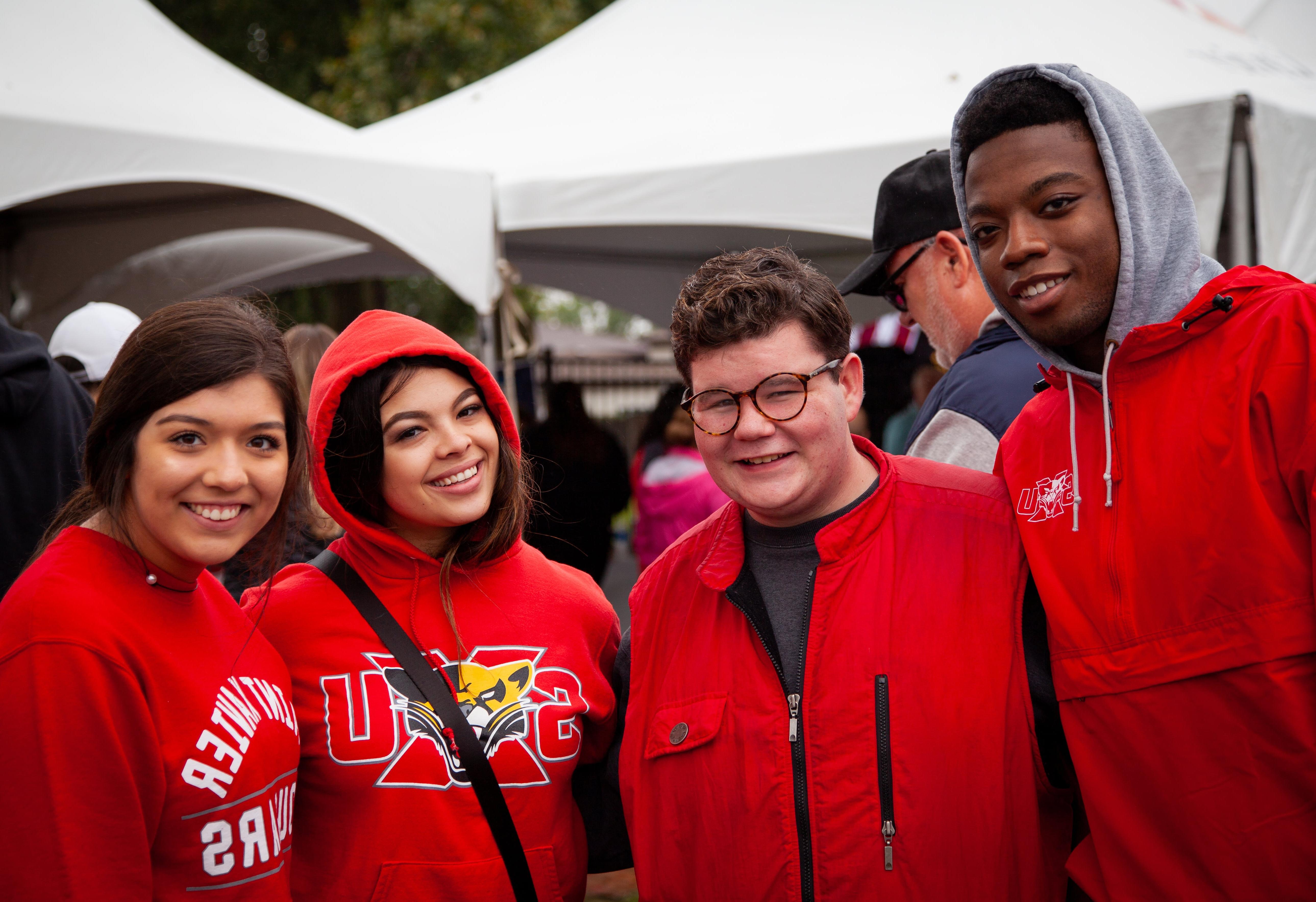 Students at Homecoming Tent